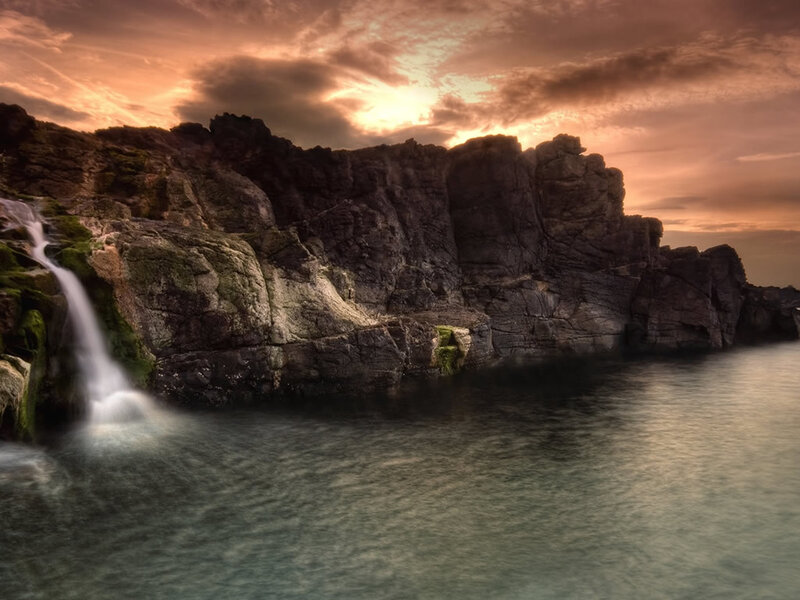 Waterfall at coastal cliffs