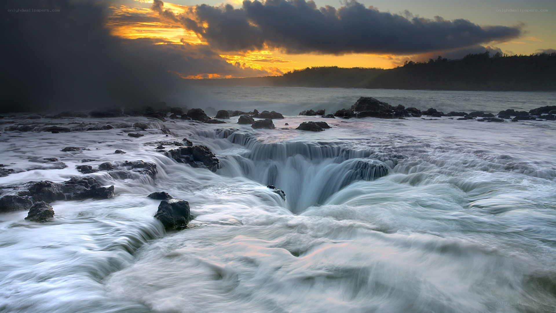 Waterfall at coastal rocks