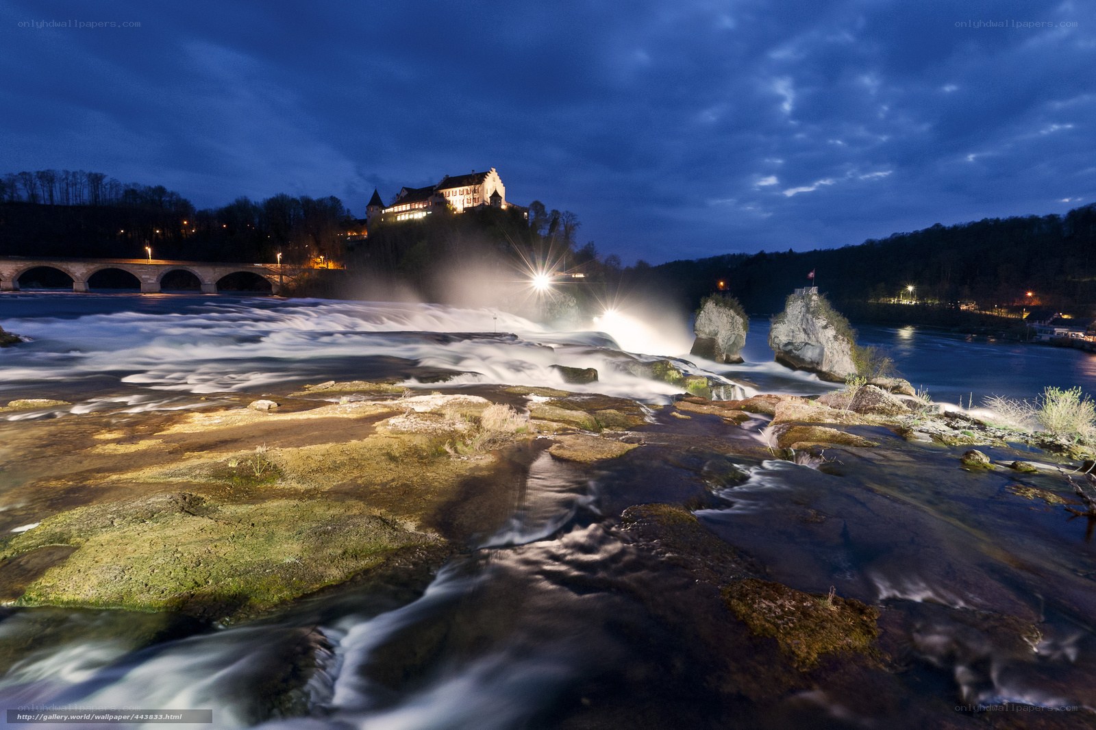 Waterfall at dusk with castle