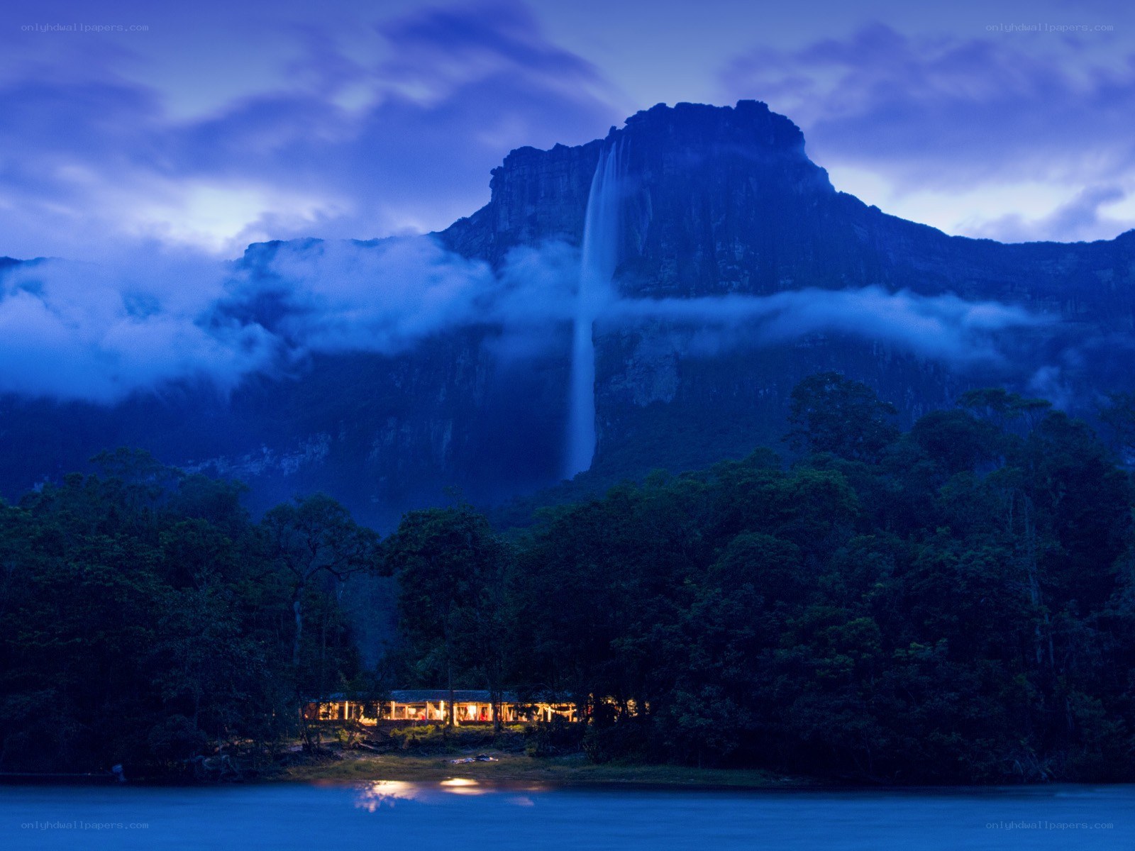 Waterfall at dusk with lodge