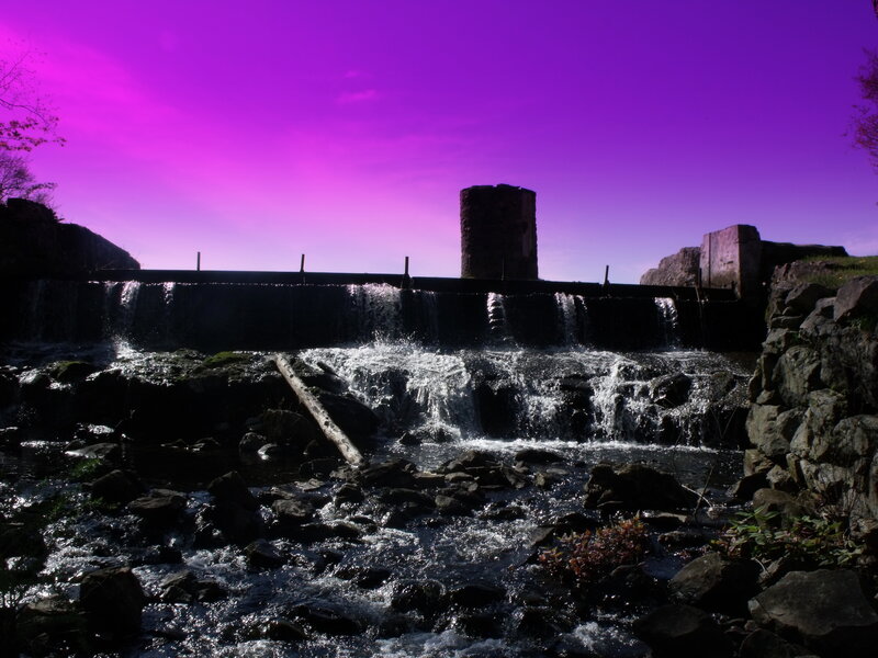 Waterfall at dusk with purple sky