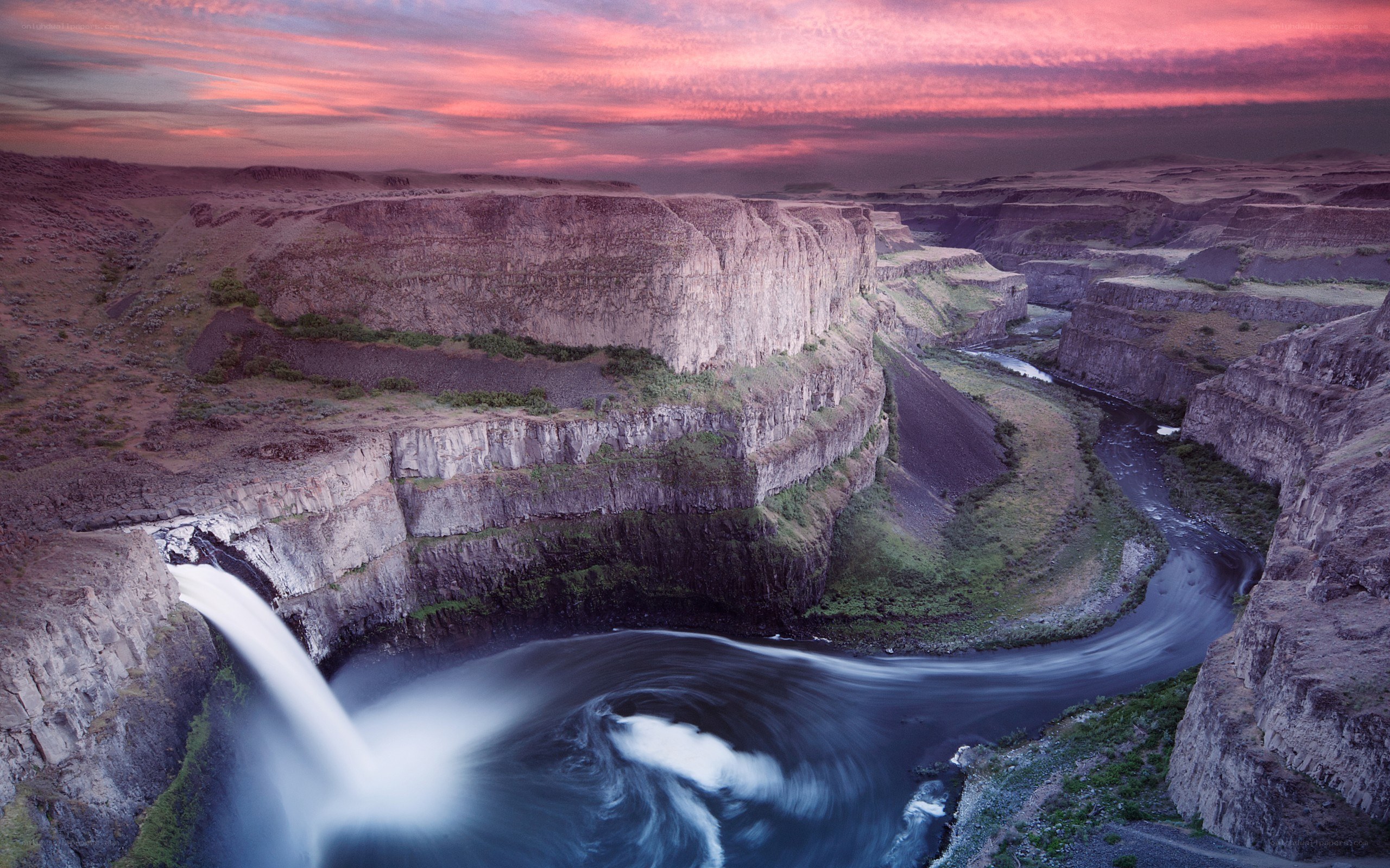 Waterfall at sunset in a canyon