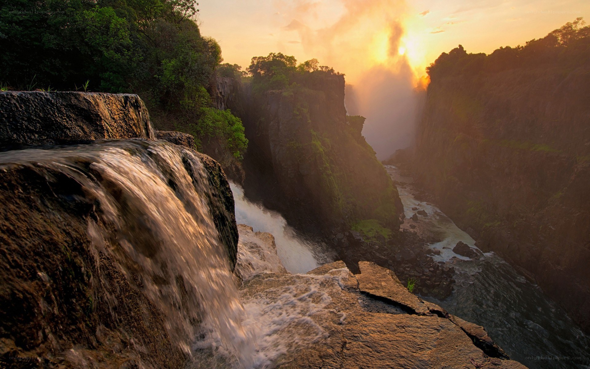 Waterfall at sunset in a canyon