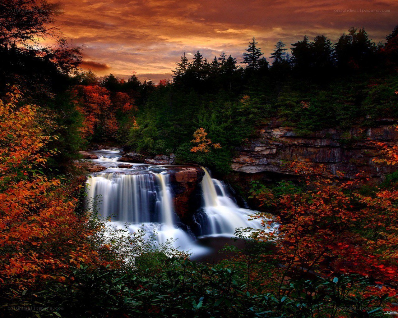 Waterfall at sunset in autumn