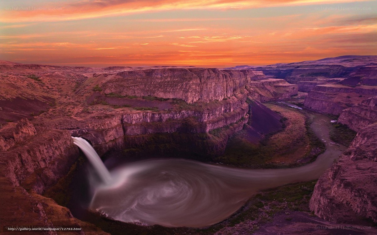 Waterfall at sunset in canyon