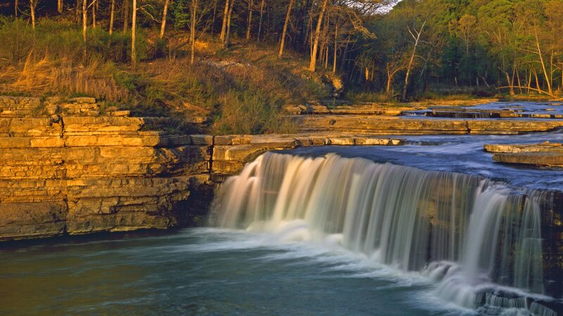 Waterfall at sunset in forest
