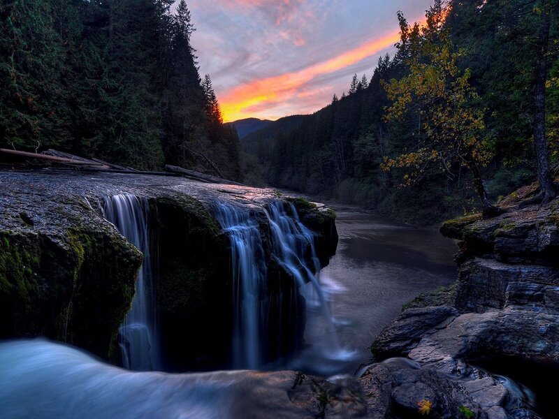 Waterfall at sunset in forest