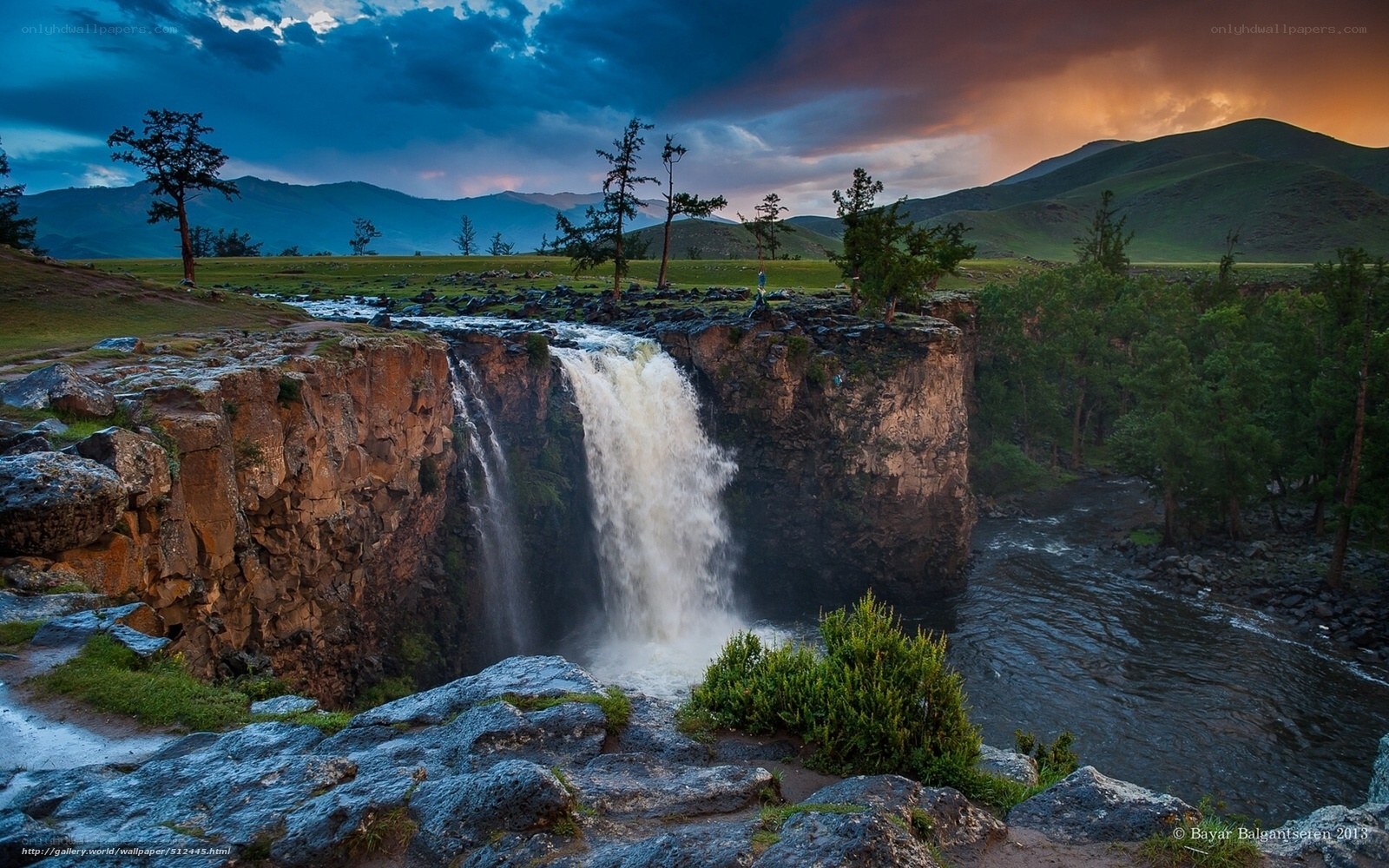 Waterfall at sunset in mountains