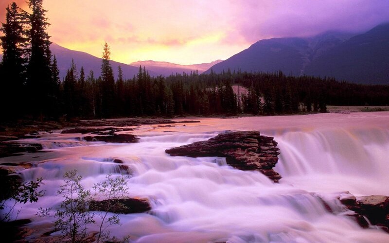 Waterfall at sunset in mountains