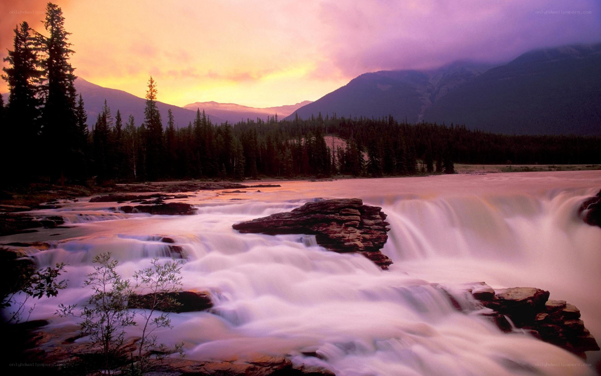 Waterfall at sunset in mountains