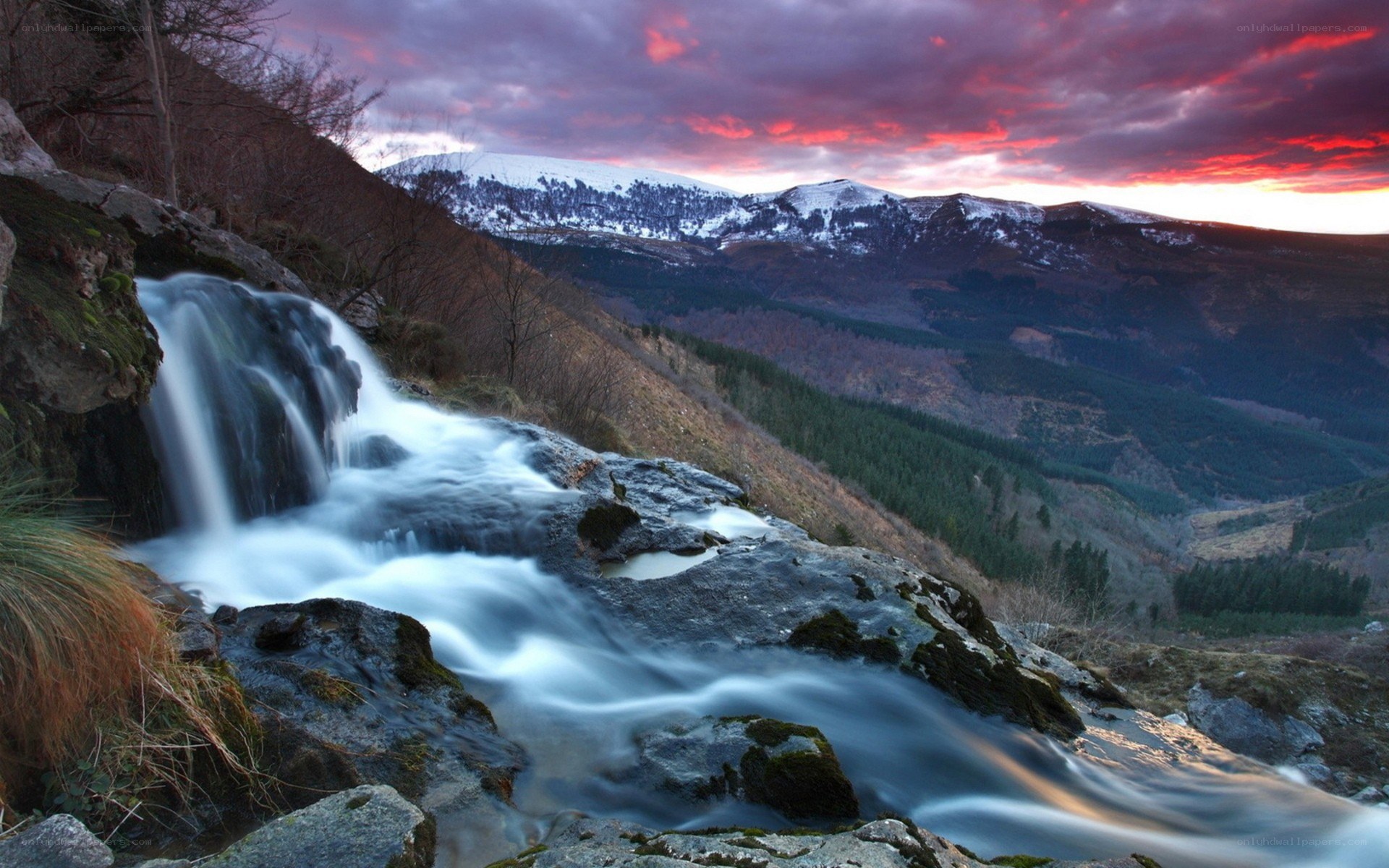 Waterfall at sunset in mountains