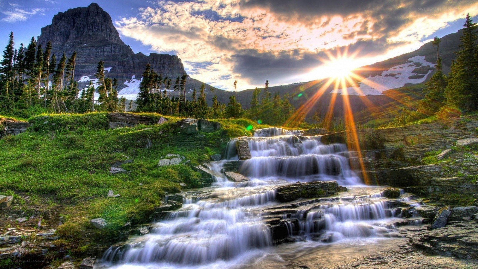 Waterfall at sunset in mountains