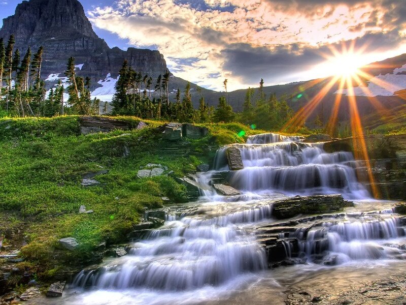 Waterfall at sunset in mountains