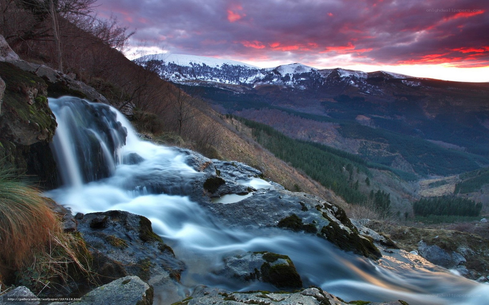 Waterfall at sunset in mountains
