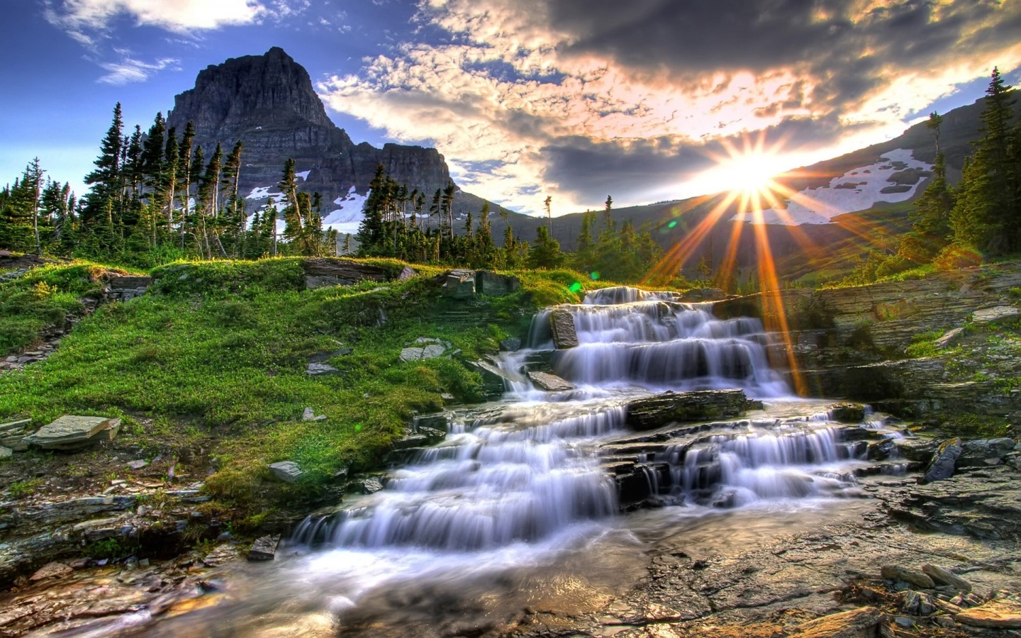 Waterfall at sunset in the mountains