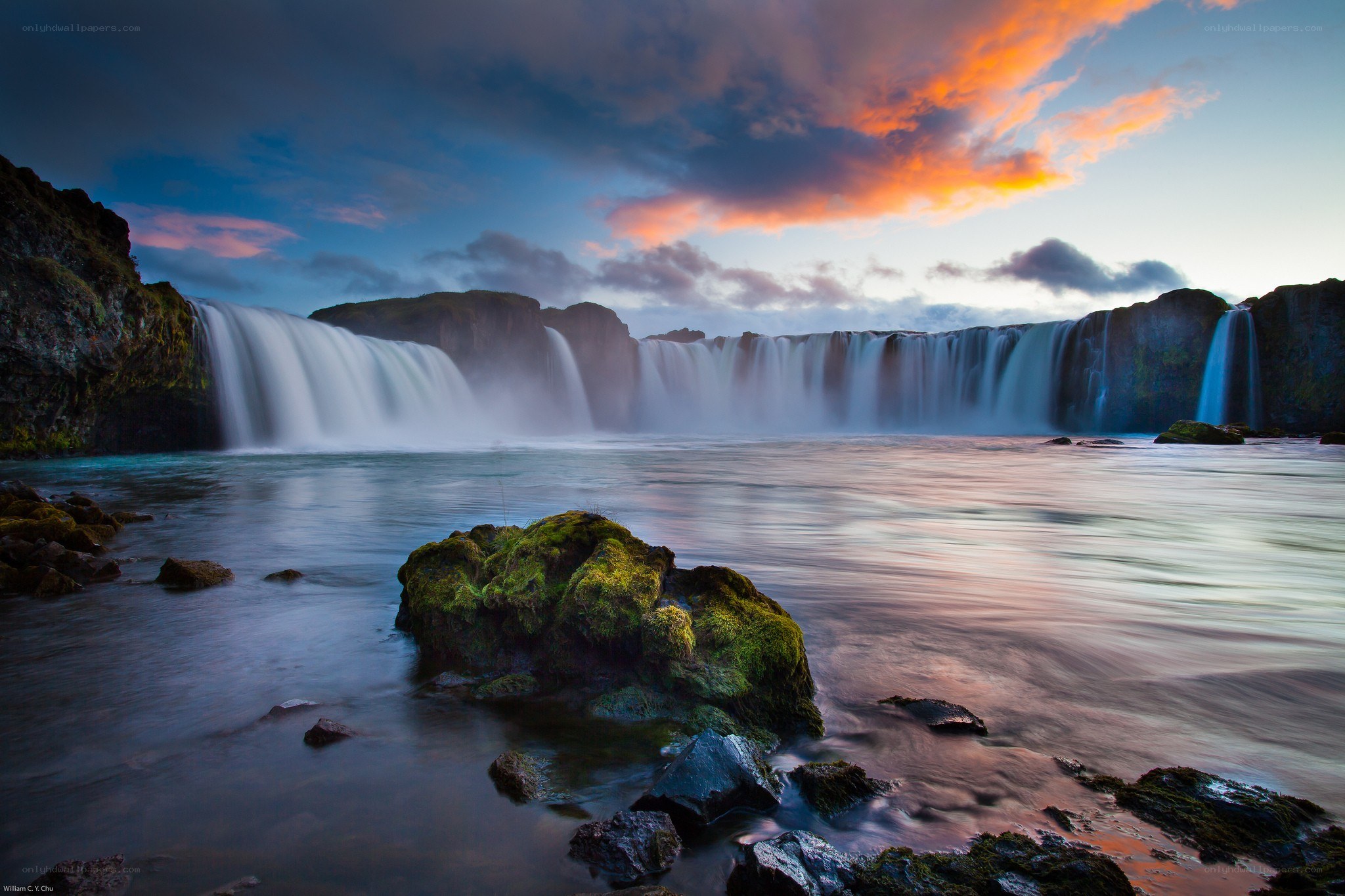 Waterfall at sunset with colorful sky