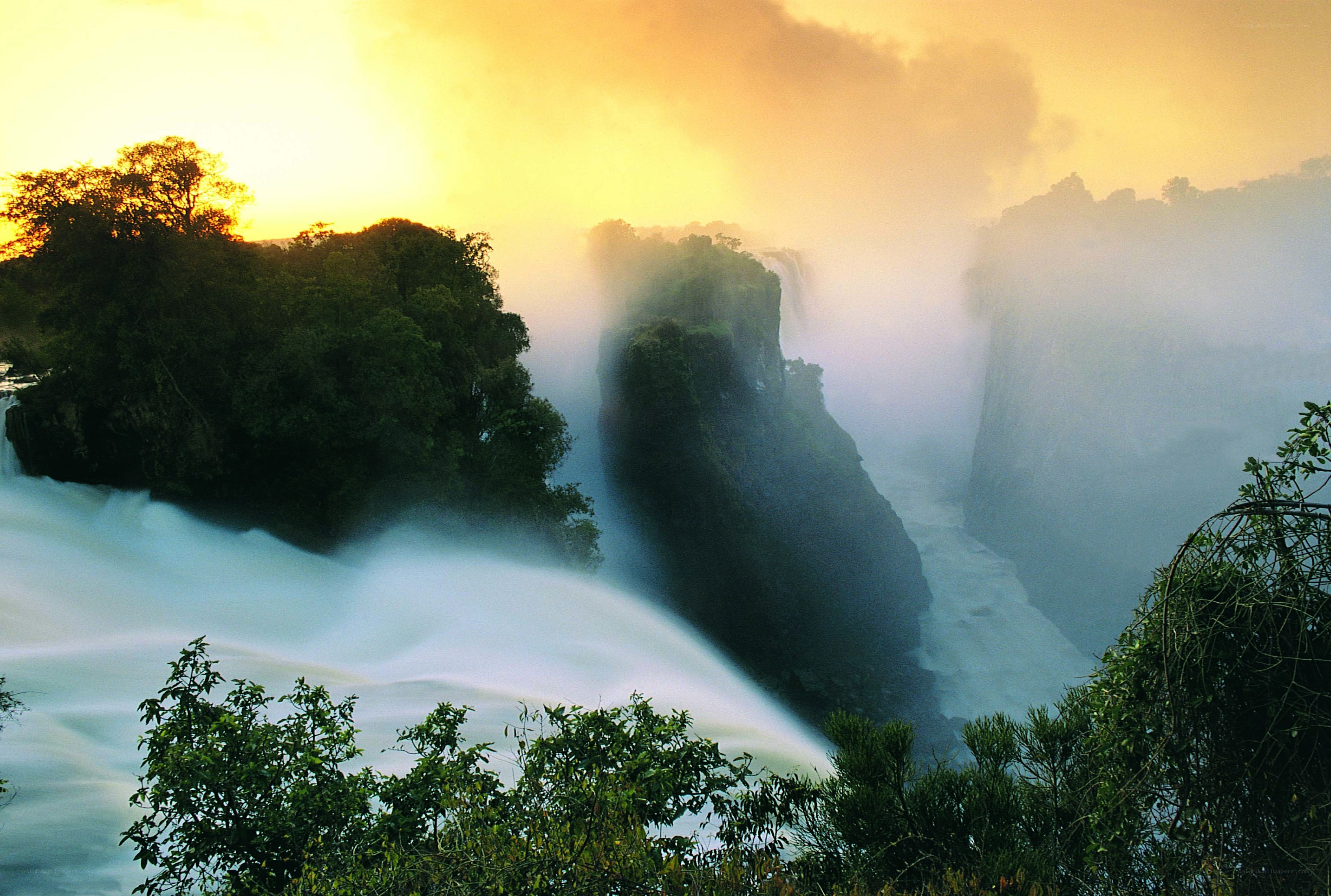 Waterfall at sunset with mist