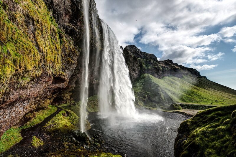 Waterfall cascading down a mossy cliff