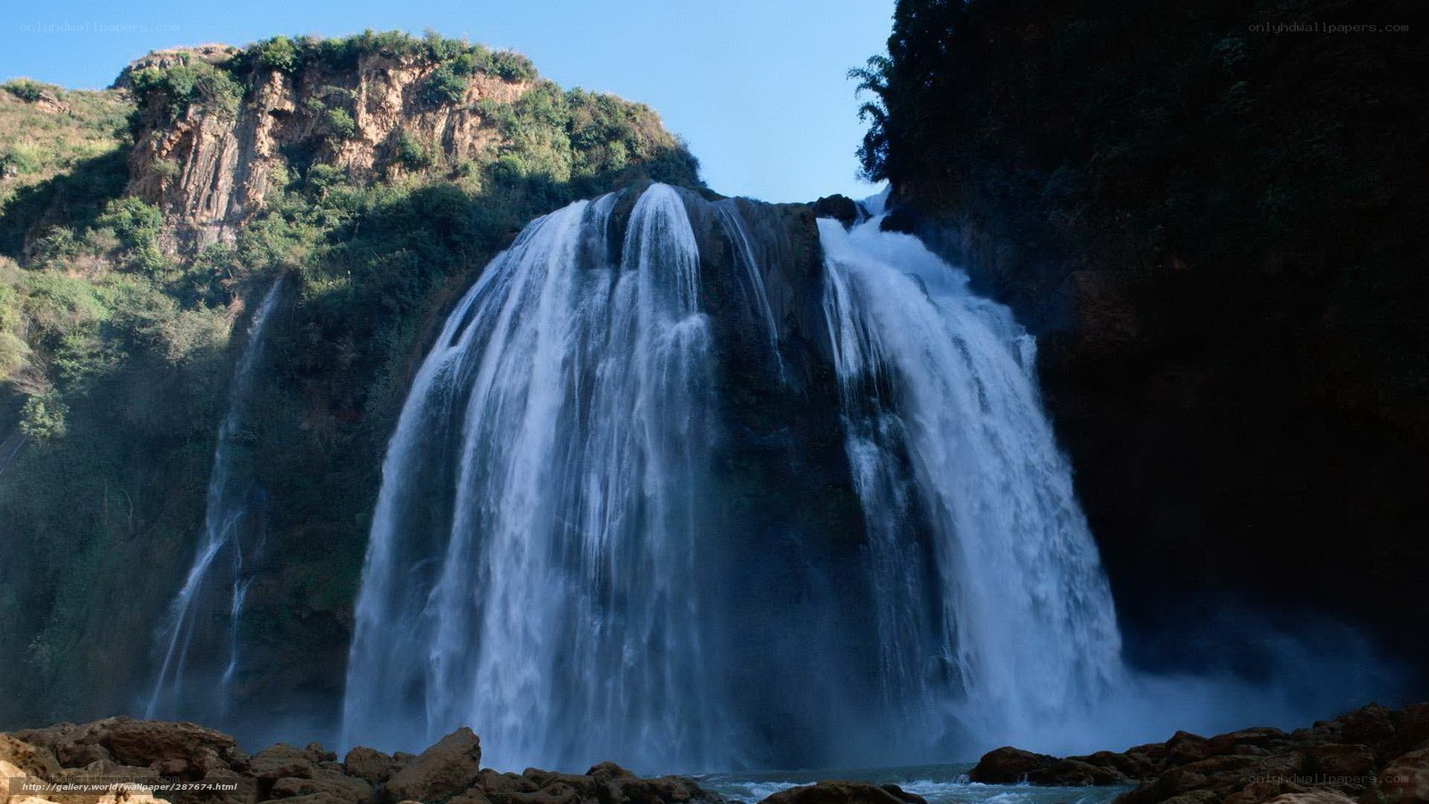 Waterfall cascading down cliff