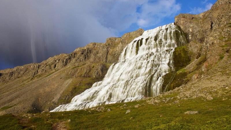 Waterfall cascading down mountain