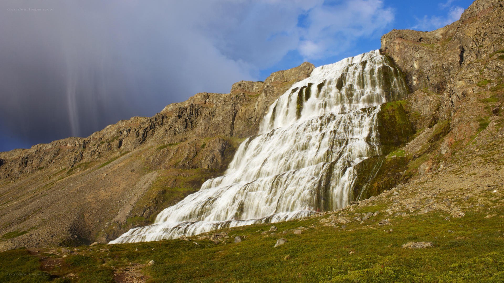 Waterfall cascading down mountain