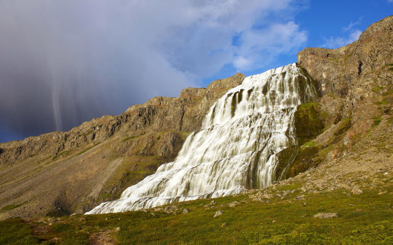 Waterfall cascading down mountain