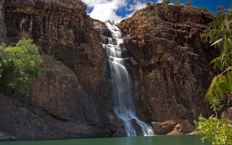 Waterfall cascading down rocky cliff