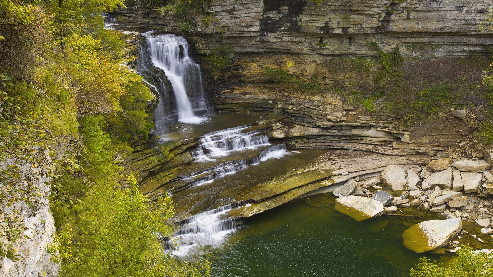 Waterfall cascading down rocky cliffs