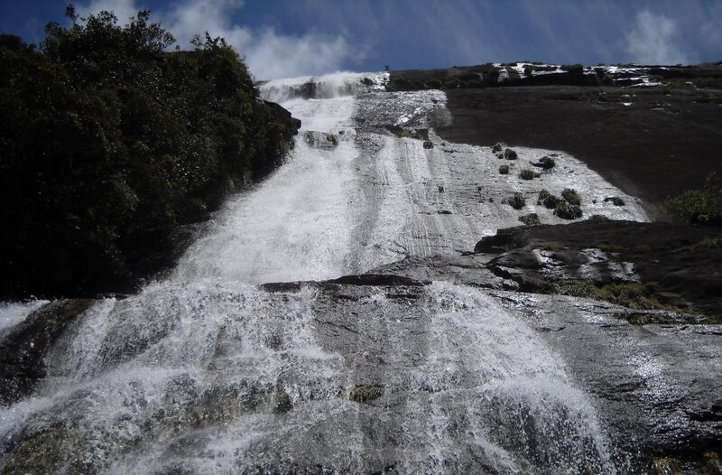 Waterfall cascading down rocky slope