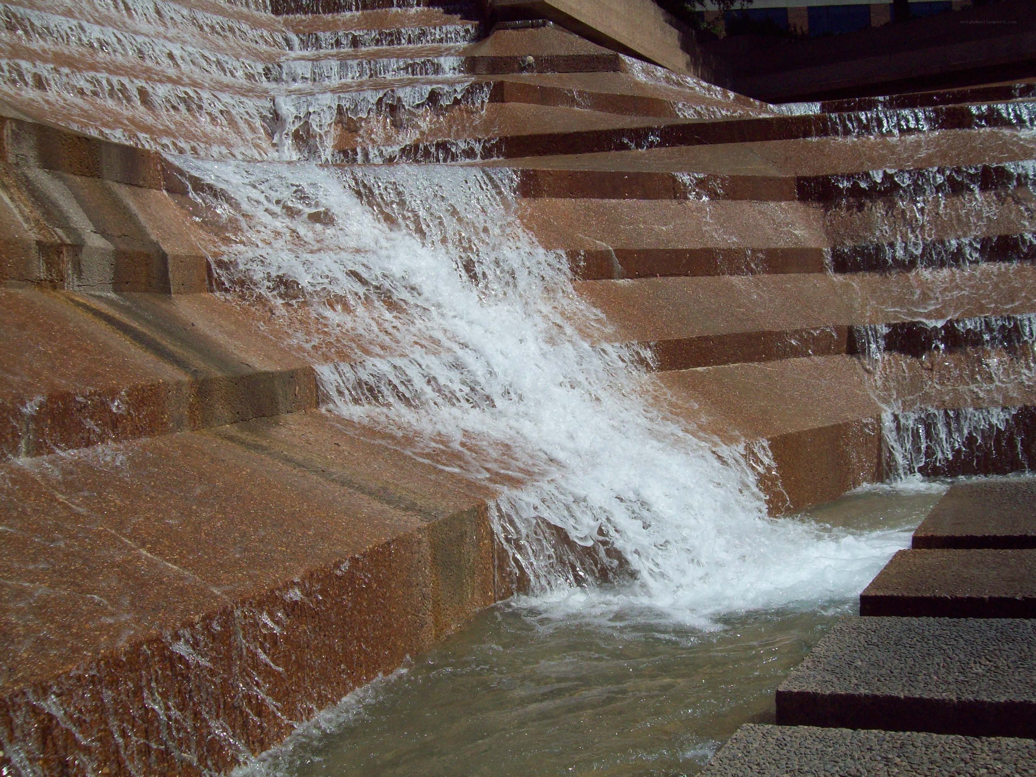 Waterfall cascading down stone steps