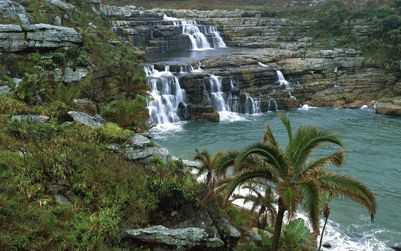 Waterfall cascading into ocean