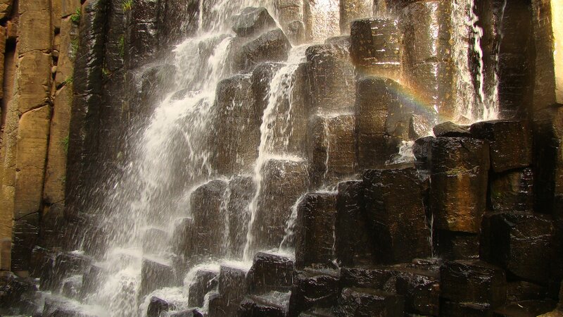 Waterfall cascading over basalt columns