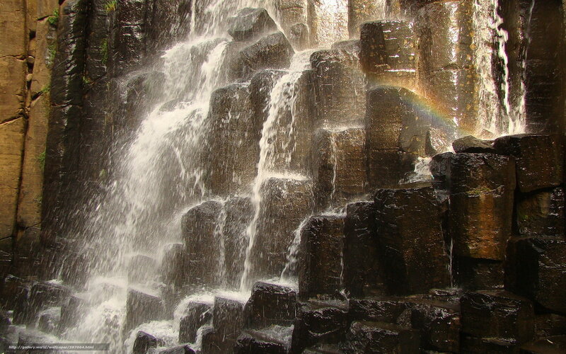Waterfall cascading over basalt columns