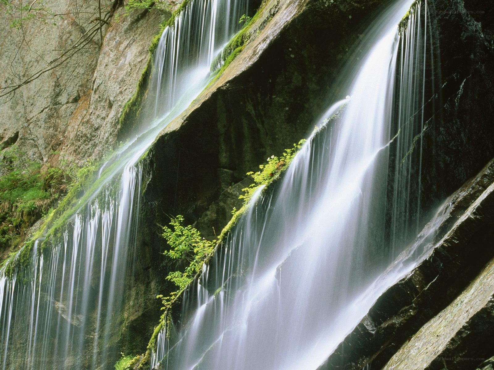 Waterfall cascading over mossy rocks