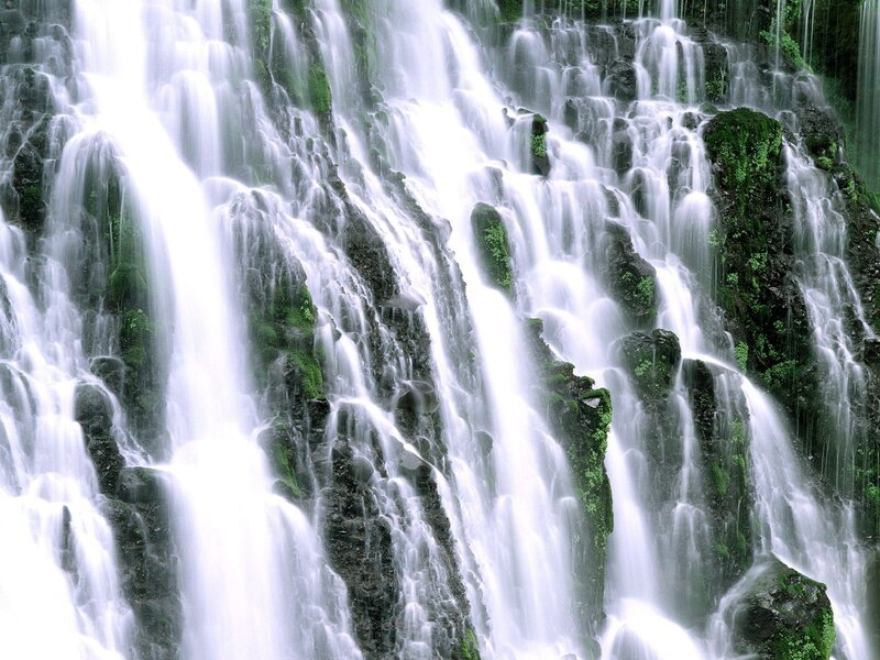 Waterfall cascading over mossy rocks