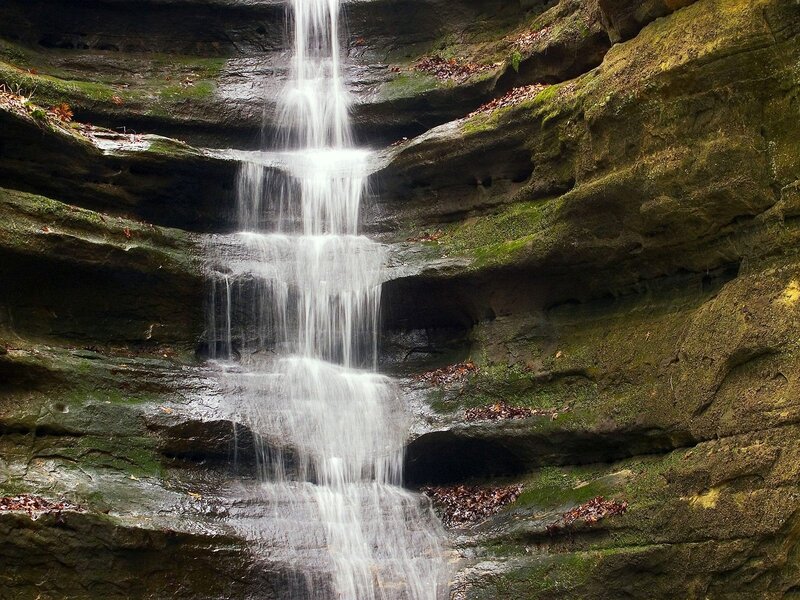 Waterfall cascading over mossy rocks
