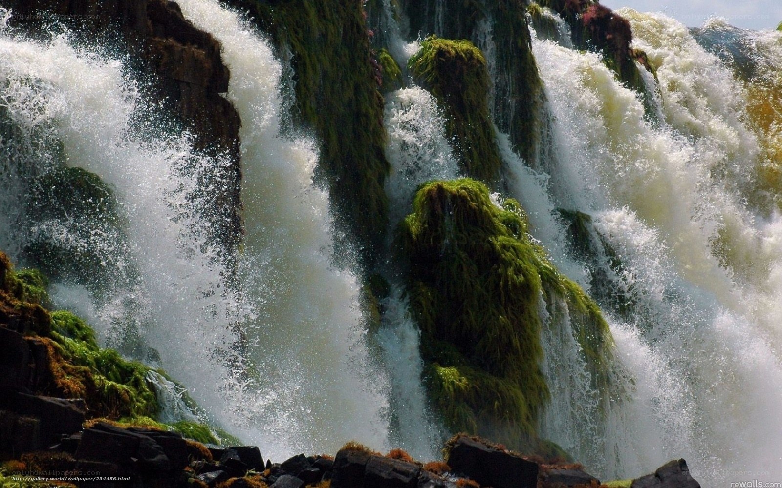 Waterfall cascading over mossy rocks