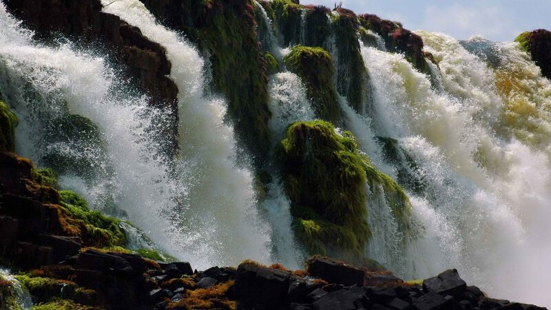 Waterfall cascading over mossy rocks