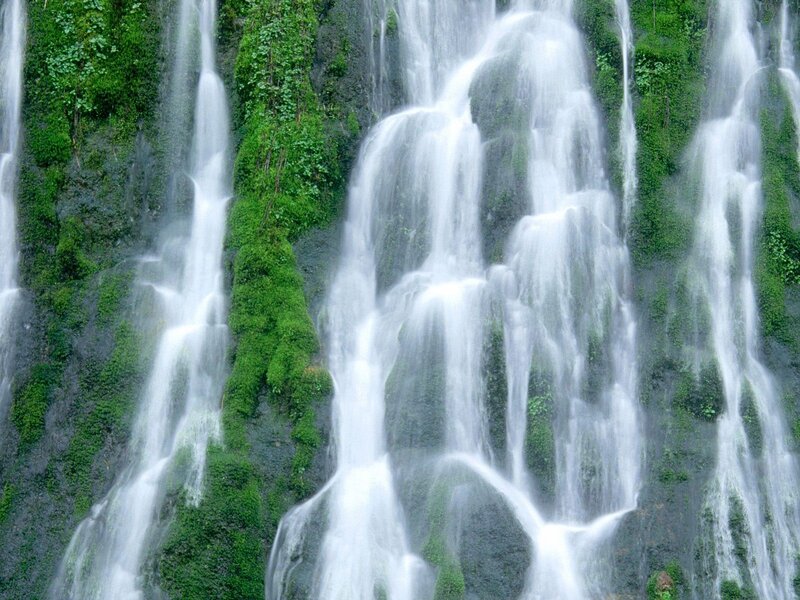 Waterfall cascading over mossy rocks