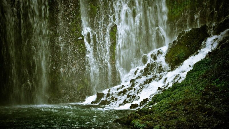 Waterfall cascading over mossy rocks
