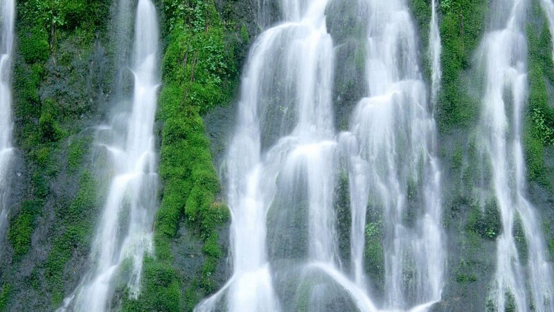 Waterfall cascading over mossy rocks