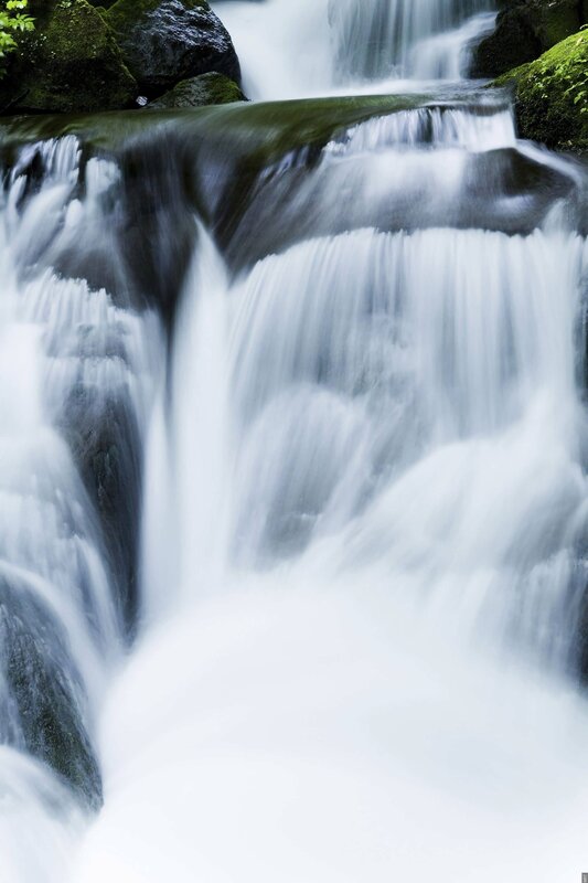 Waterfall cascading over mossy rocks