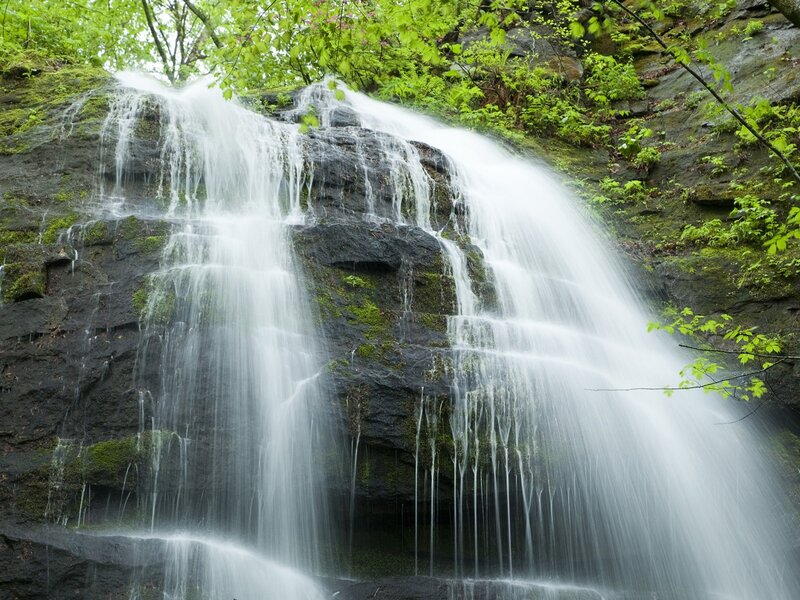 Waterfall cascading over mossy rocks