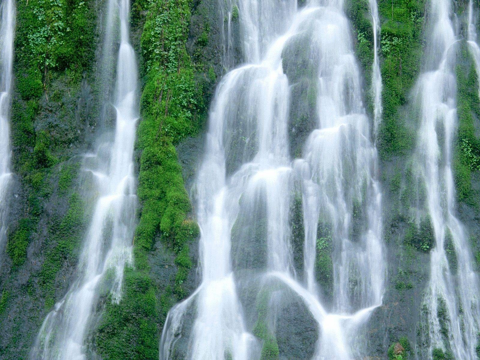 Waterfall cascading over mossy rocks
