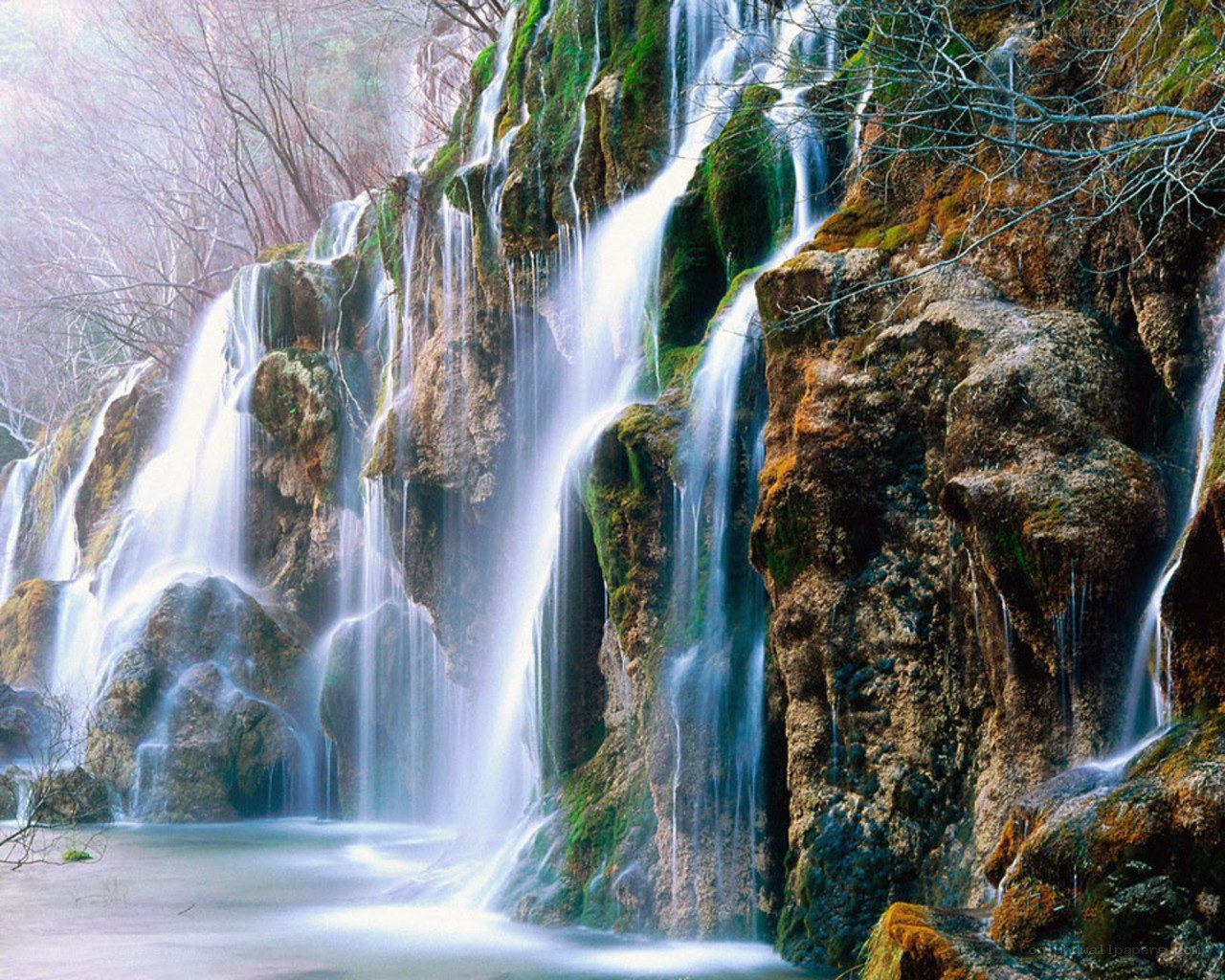 Waterfall cascading over mossy rocks