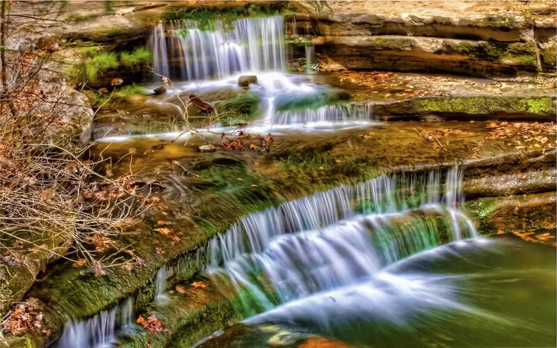 Waterfall cascading over mossy rocks