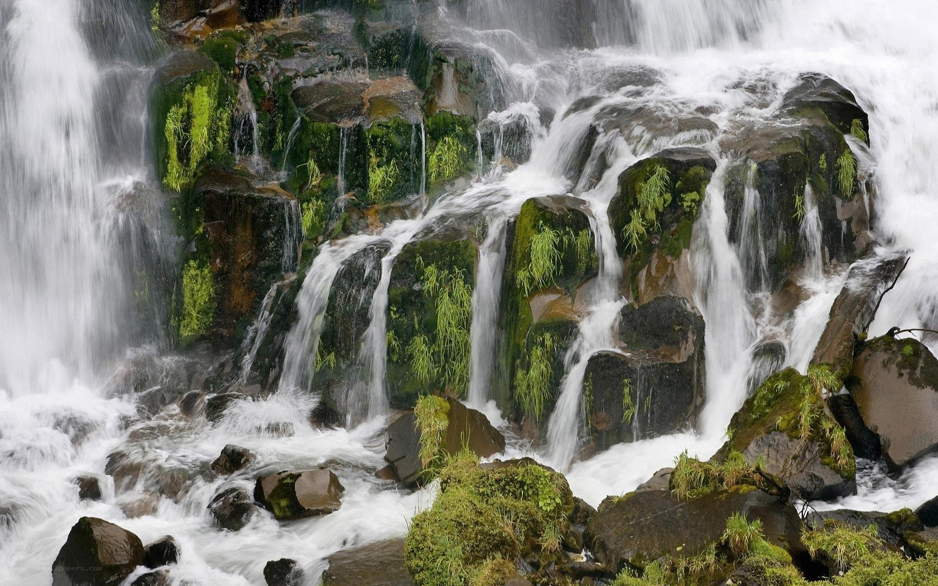 Waterfall cascading over mossy rocks