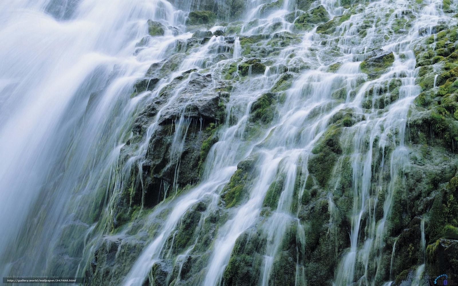 Waterfall cascading over mossy rocks