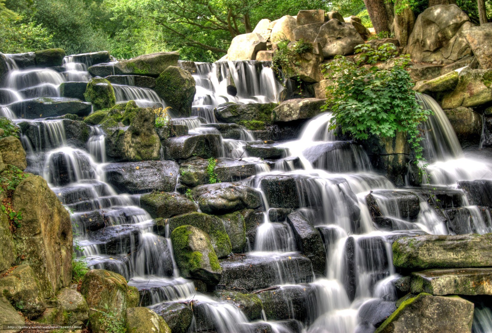 Waterfall cascading over mossy rocks
