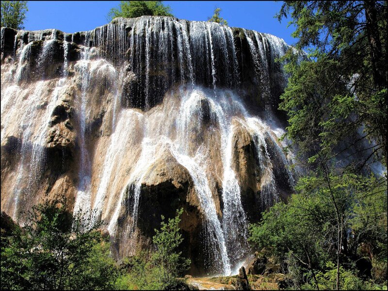 Waterfall cascading over rock face